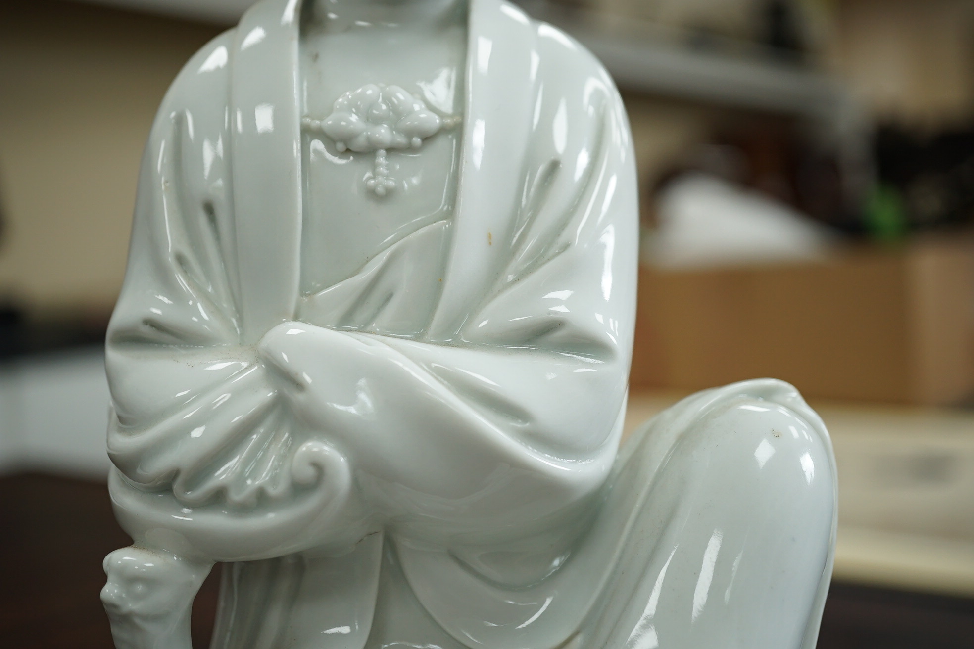 A Chinese blanc-de-chine seated figure of Guanyin, late 19th/early 20th century
